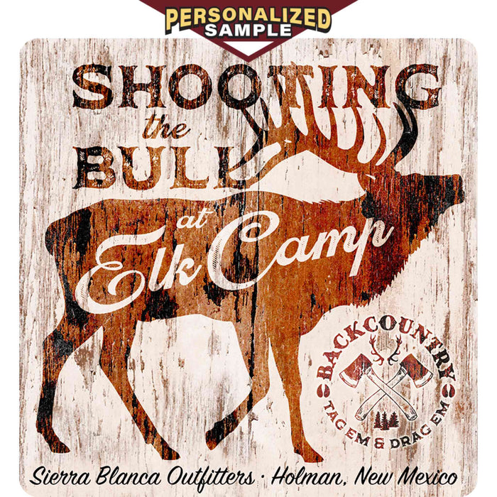 Personalized Example of Sunshine Corner's, customizable elk wall decor that says, "Shooting the bull at elk camp - Back Country - Tag 'Em & Drag 'Em - Sierra Blanca Outfitters - Holman, New Mexico".